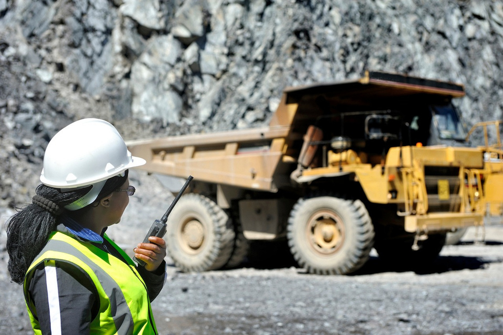Mining operator coordinating haul truck activity